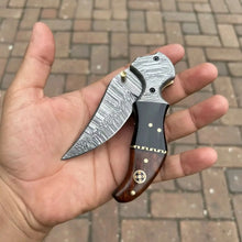 Load image into Gallery viewer, Damascus Recurve Folding Pocket Knife — Liner Lock, Black Resin &amp; Wood Handle, Brass Spacer &amp; Pocket Clip