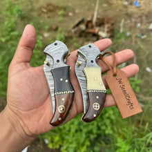 Load image into Gallery viewer, 2-Piece Damascus Hawkbill Folding Pocket Knives — Liner Lock, Rosewood Black &amp; Cream Resin Handles, Brass Bolsters