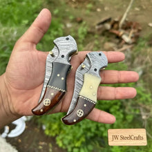 Load image into Gallery viewer, 2-Piece Damascus Hawkbill Folding Pocket Knives — Liner Lock, Rosewood Black &amp; Cream Resin Handles, Brass Bolsters