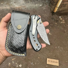 Load image into Gallery viewer, Damascus Steel Folding Pocket Knife — Recurve Clip Point Blade, Black Resin Handle, Pocket Clip &amp; Cowhide Leather Sheath