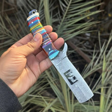 Load image into Gallery viewer, Damascus Bull Cutter Knife — Multi-Color Rainbow Resin Handle, Christian Cross Blade Engraving, Steel Bolster &amp; Lanyard Hole