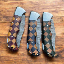 Load image into Gallery viewer, Handmade Damascus Folding Knife – Checker Pattern Wood Handle (Red, Green, Blue) with Leather Sheath