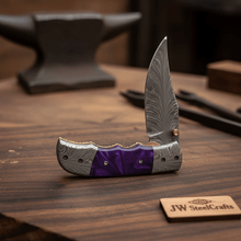 Load image into Gallery viewer, Handmade Feather Pattern Damascus Folding Knife with Purple Resin Handle &amp; Leather Sheath