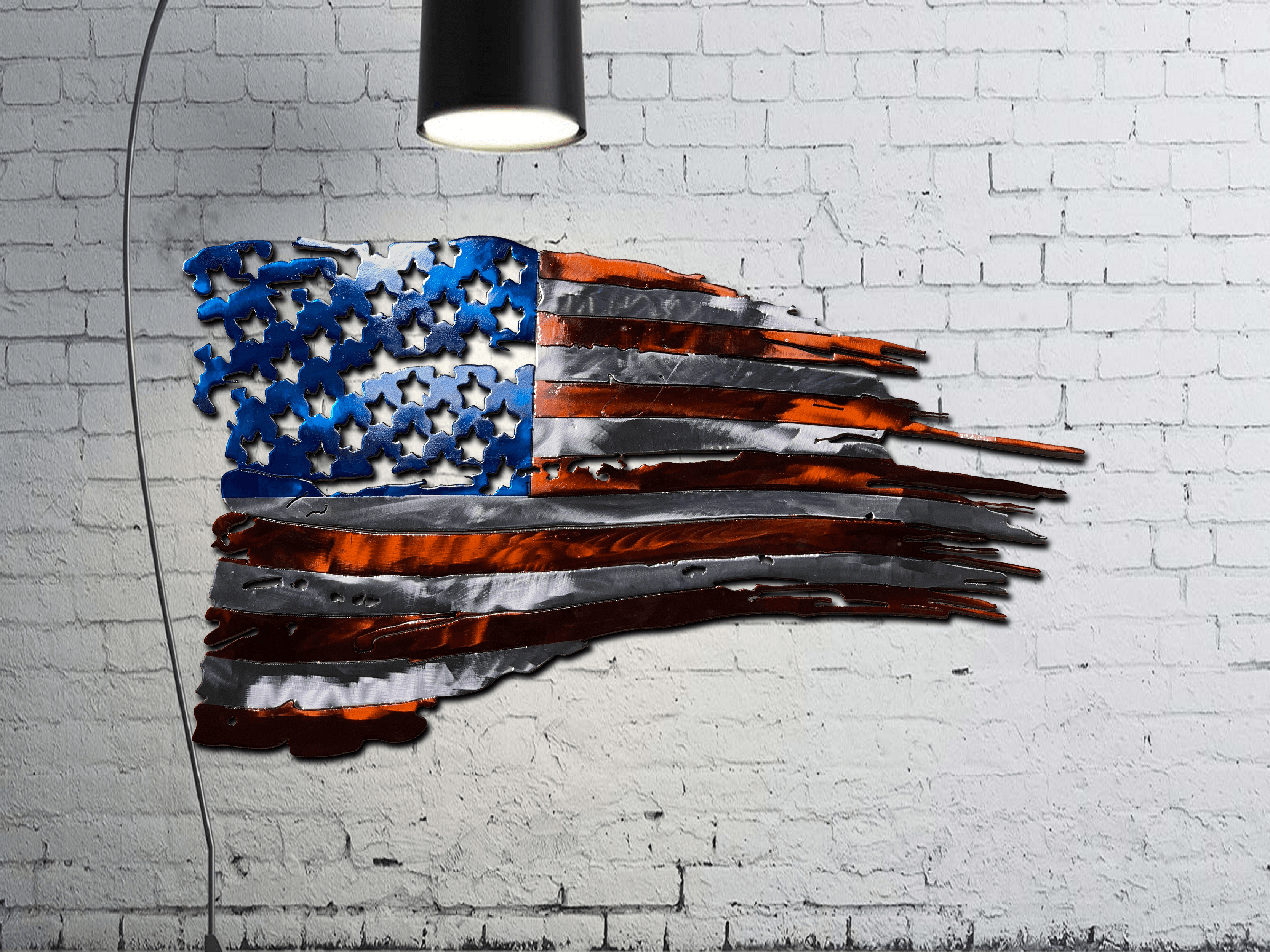https://texasmetalmakers.com/cdn/shop/products/Tattered_American_Flag_Mockup_on_White_Brick_with_spotlight_3334x.png?v=1555468951